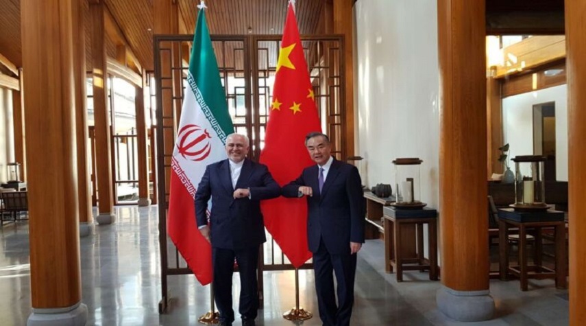 ظريف: لدى طهران رغبة في تعزيز التعاون المشترك مع بكين
